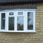 a white upvc bow window